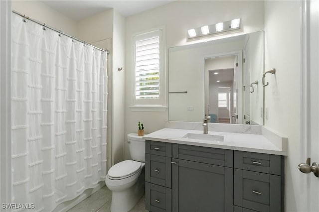 3240 Pilot Cir, Naples, FL 34120 - full bathroom featuring vanity, plenty of natural light, and tile patterned flooring