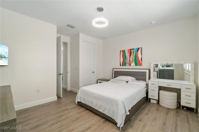 3240 Pilot Cir, Naples, FL 34120 - bedroom featuring light wood-style flooring