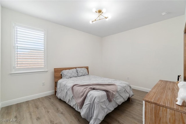 3240 Pilot Cir, Naples, FL 34120 - bedroom featuring light wood-style floors and baseboards