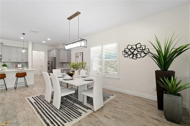 3240 Pilot Cir, Naples, FL 34120 - dining room with light wood-style floors and recessed lighting