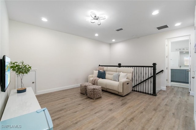 3240 Pilot Cir, Naples, FL 34120 - living room featuring light wood-style flooring and recessed lighting