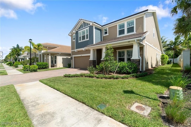 3240 Pilot Cir, Naples, FL 34120 - craftsman inspired home featuring a garage, driveway, a front yard, stone siding, and stucco siding