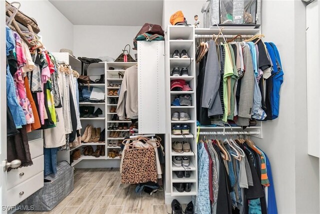 3240 Pilot Cir, Naples, FL 34120 - spacious closet with wood finished floors