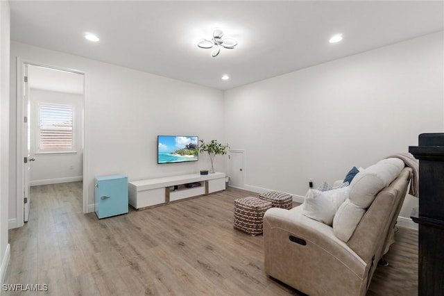 3240 Pilot Cir, Naples, FL 34120 - living room with light wood-style flooring and recessed lighting