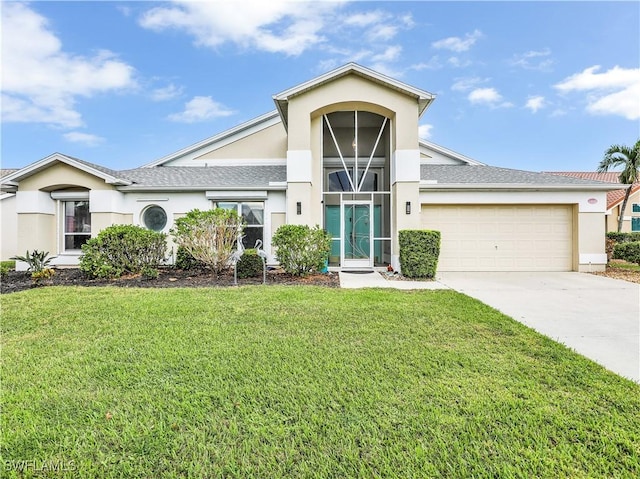 14891 Lake Olive Dr, Fort Myers, FL 33919 - view of front of house with stucco siding, a garage, driveway, and a front lawn