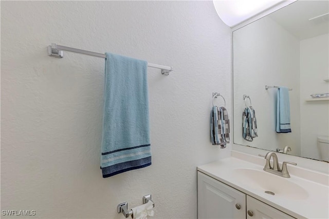 1271 16th St NE, Naples, FL 34120 - bathroom with vanity and toilet