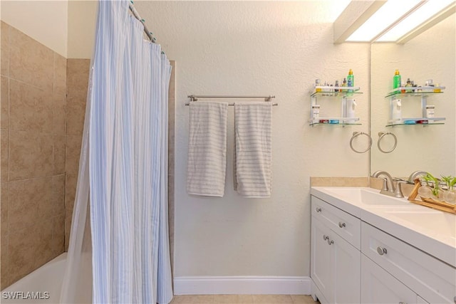 1271 16th St NE, Naples, FL 34120 - full bathroom with double vanity and shower / bath combination with curtain