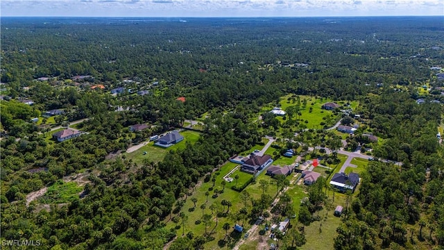 1271 16th St NE, Naples, FL 34120 - aerial view of property and surrounding area featuring a heavily wooded area
