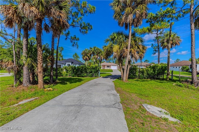 1271 16th St NE, Naples, FL 34120 - view of front facade with a front yard and a residential view