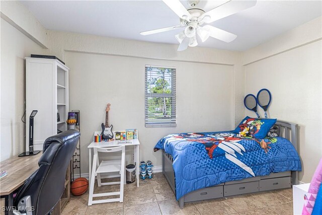 1271 16th St NE, Naples, FL 34120 - tiled bedroom with ceiling fan and an office area