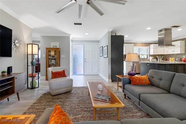 1015 El Valle Ave, Fort Myers, FL 33919 - living area with crown molding, light wood-style flooring, ceiling fan, and recessed lighting