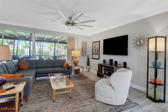 1015 El Valle Ave, Fort Myers, FL 33919 - living room featuring a ceiling fan, wood finished floors, and ornamental molding