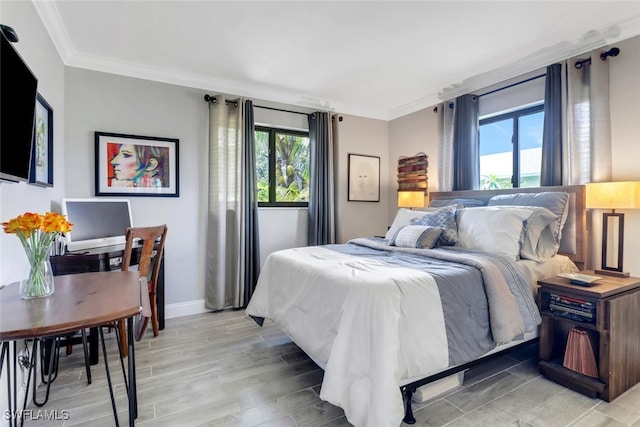1015 El Valle Ave, Fort Myers, FL 33919 - bedroom with ornamental molding and light wood finished floors