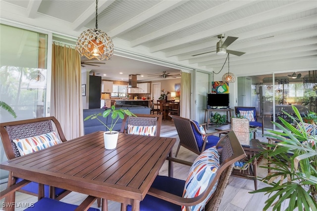 1015 El Valle Ave, Fort Myers, FL 33919 - dining space featuring a ceiling fan, a chandelier, beam ceiling, and light wood finished floors