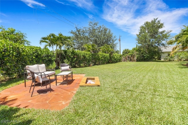 1015 El Valle Ave, Fort Myers, FL 33919 - view of grassy yard featuring a fire pit and a patio area