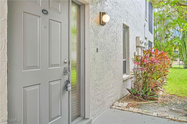 4217 SE 19th Ave Unit 110, Cape Coral, FL 33904 - view of exterior entry with stucco siding