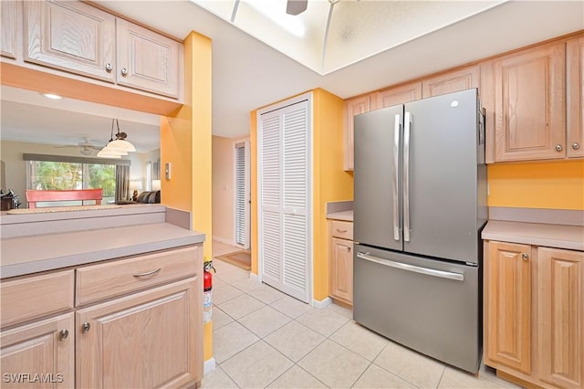 4217 SE 19th Ave Unit 110, Cape Coral, FL 33904 - kitchen featuring freestanding refrigerator, ceiling fan, and light brown cabinetry