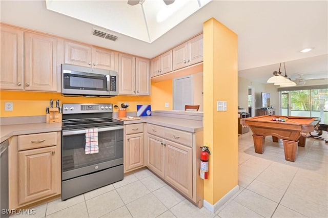 4217 SE 19th Ave Unit 110, Cape Coral, FL 33904 - kitchen featuring appliances with stainless steel finishes, light brown cabinetry, and light tile patterned floors