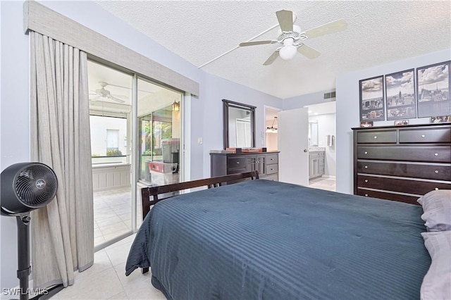 4217 SE 19th Ave Unit 110, Cape Coral, FL 33904 - bedroom with access to outside, connected bathroom, tile patterned flooring, a textured ceiling, and ceiling fan