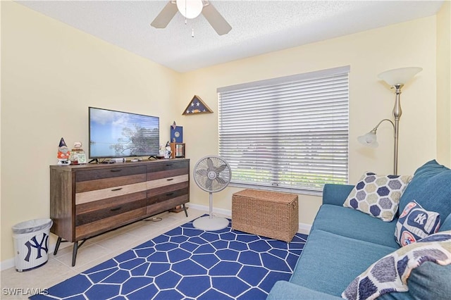 4217 SE 19th Ave Unit 110, Cape Coral, FL 33904 - tiled living room featuring a ceiling fan and a textured ceiling