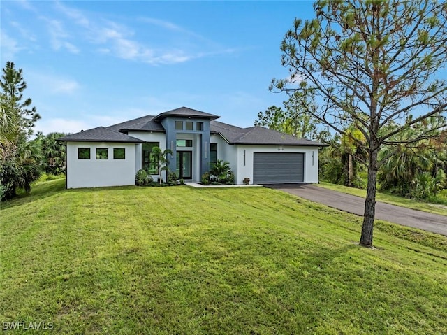 3614 22nd Ave NE, Naples, FL 34120 - prairie-style house with stucco siding, asphalt driveway, a garage, a front lawn, and a shingled roof