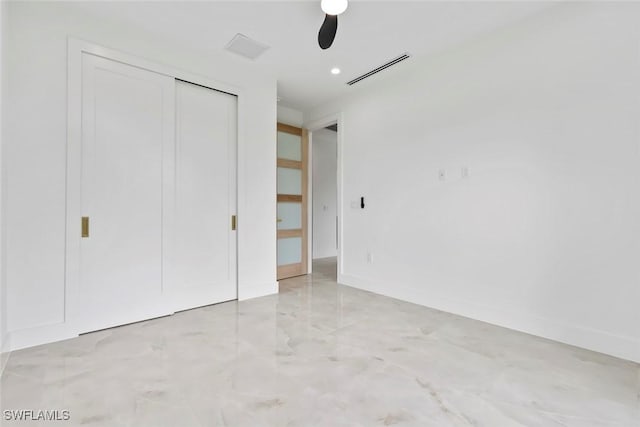 3614 22nd Ave NE, Naples, FL 34120 - unfurnished bedroom featuring a closet and a ceiling fan