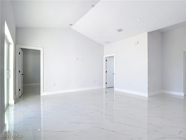 5001 Bywood St, Lehigh Acres, FL 33971 - unfurnished room with light marble finish floors, lofted ceiling, and recessed lighting