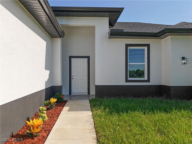 5001 Bywood St, Lehigh Acres, FL 33971 - property entrance with stucco siding and roof with shingles