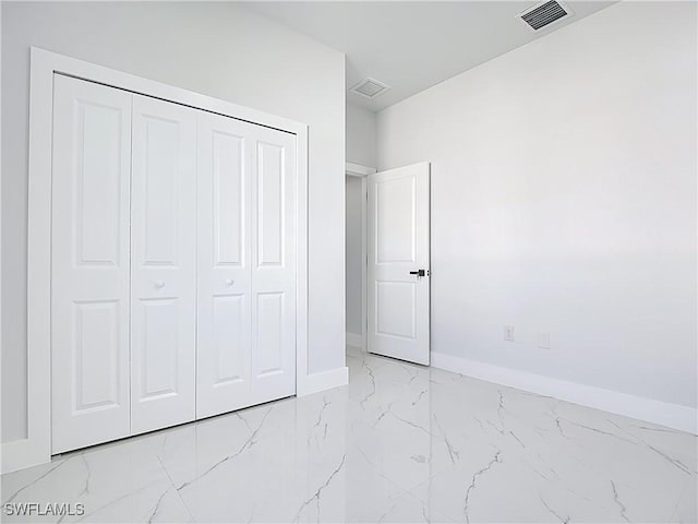 5001 Bywood St, Lehigh Acres, FL 33971 - unfurnished bedroom with light marble finish flooring and a closet