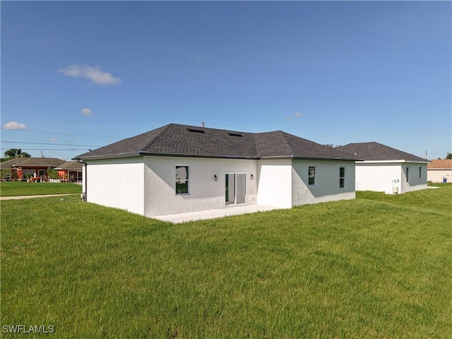 5001 Bywood St, Lehigh Acres, FL 33971 - rear view of property with a yard and stucco siding