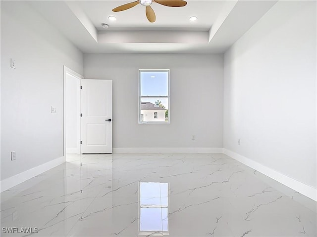 5001 Bywood St, Lehigh Acres, FL 33971 - empty room featuring a raised ceiling, a ceiling fan, light marble finish flooring, recessed lighting, and a smoke detector