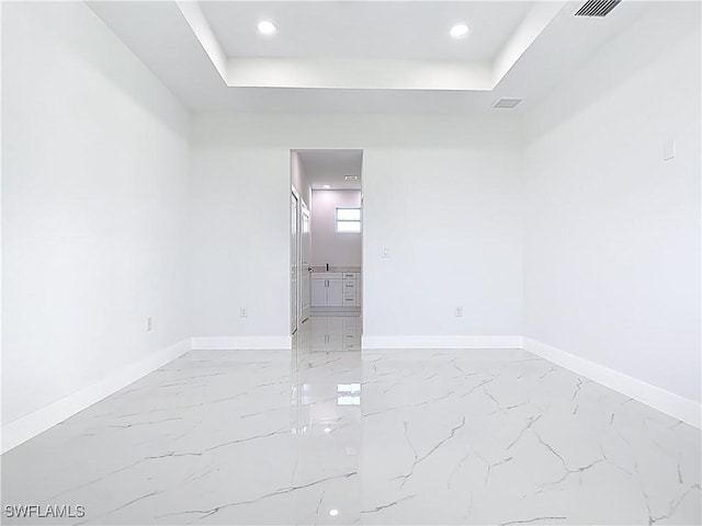 5001 Bywood St, Lehigh Acres, FL 33971 - unfurnished room with light marble finish flooring, a raised ceiling, and recessed lighting