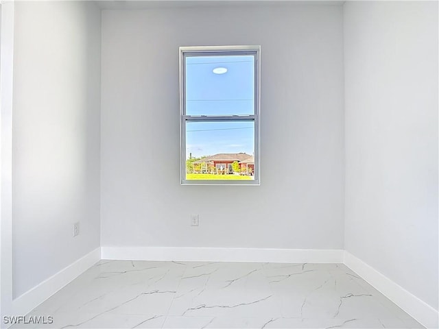 5001 Bywood St, Lehigh Acres, FL 33971 - empty room with baseboards and marble look tile flooring