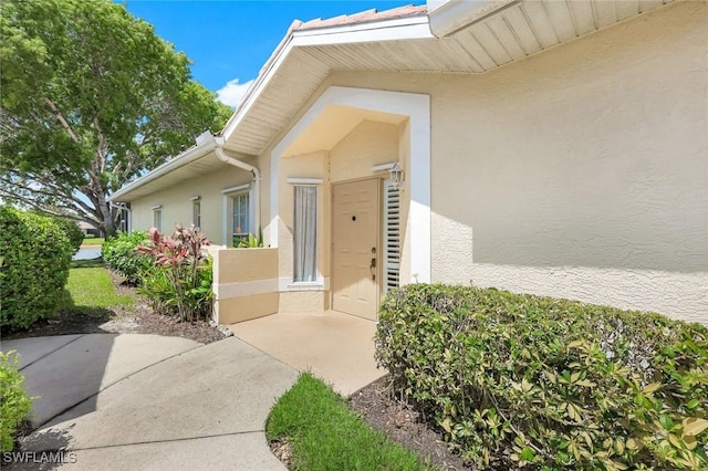 6956 Lone Oak Blvd, Naples, FL 34109 - entrance to property with stucco siding