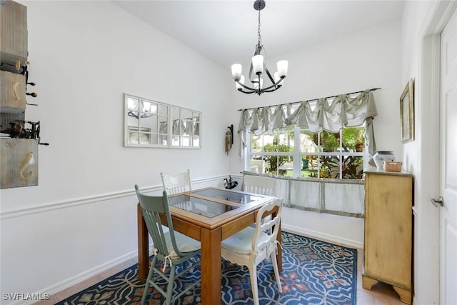 6956 Lone Oak Blvd, Naples, FL 34109 - dining space with a chandelier and baseboards