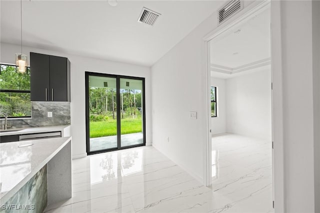 3525 43rd Ave NE, Naples, FL 34120 - doorway to outside featuring light marble finish flooring and healthy amount of natural light