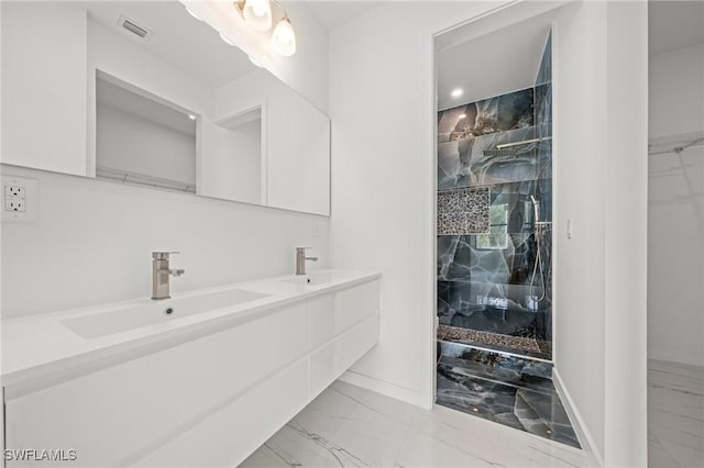 3525 43rd Ave NE, Naples, FL 34120 - full bath featuring marble look tiles, double vanity, and a walk in closet