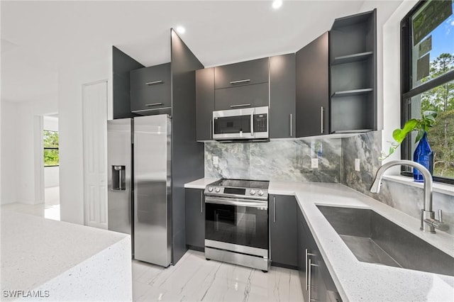 3525 43rd Ave NE, Naples, FL 34120 - kitchen featuring stainless steel appliances, open shelves, backsplash, modern cabinets, and recessed lighting