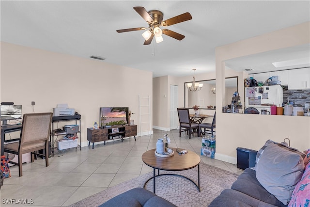 3284 Royal Canadian Trce Unit 4, Fort Myers, FL 33907 - living area featuring a chandelier, light tile patterned floors, and ceiling fan