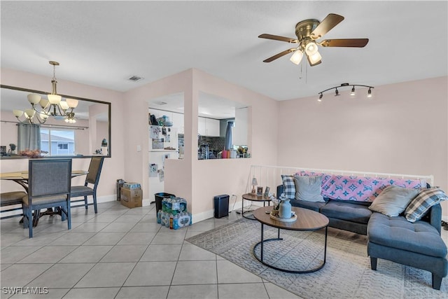 3284 Royal Canadian Trce Unit 4, Fort Myers, FL 33907 - living room featuring a chandelier, light tile patterned flooring, ceiling fan, and track lighting