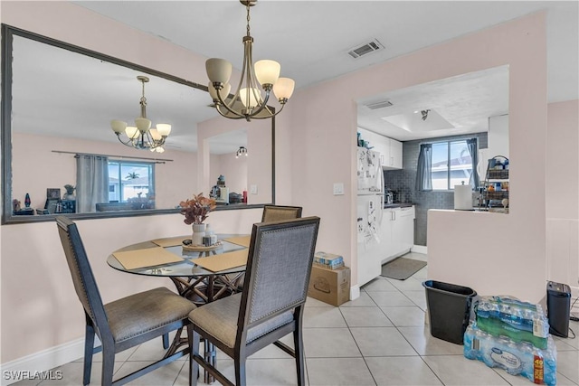 3284 Royal Canadian Trce Unit 4, Fort Myers, FL 33907 - dining area featuring a chandelier and light tile patterned floors