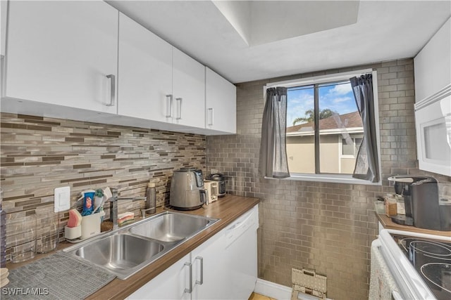 3284 Royal Canadian Trce Unit 4, Fort Myers, FL 33907 - kitchen featuring white appliances, white cabinets, and backsplash