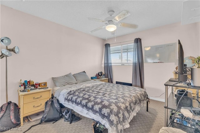 3284 Royal Canadian Trce Unit 4, Fort Myers, FL 33907 - bedroom featuring carpet, a textured ceiling, and ceiling fan