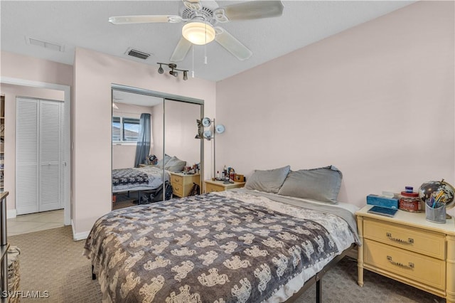 3284 Royal Canadian Trce Unit 4, Fort Myers, FL 33907 - bedroom with a closet, light carpet, and a ceiling fan