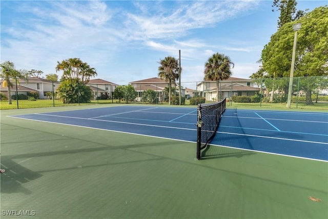 3284 Royal Canadian Trce Unit 4, Fort Myers, FL 33907 - view of tennis court with community basketball court and a residential view