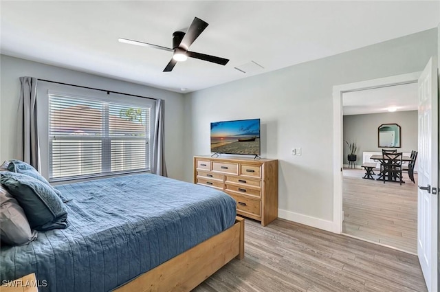 692 Hadley St E, Naples, FL 34104 - bedroom with light wood-style floors and a ceiling fan