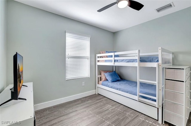 692 Hadley St E, Naples, FL 34104 - bedroom with wood finished floors and a ceiling fan