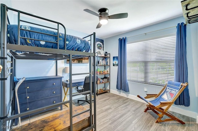 692 Hadley St E, Naples, FL 34104 - bedroom with wood finished floors and ceiling fan