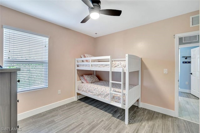692 Hadley St E, Naples, FL 34104 - bedroom with wood finished floors and ceiling fan