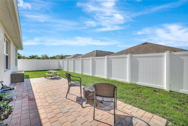 692 Hadley St E, Naples, FL 34104 - fenced backyard with a patio
